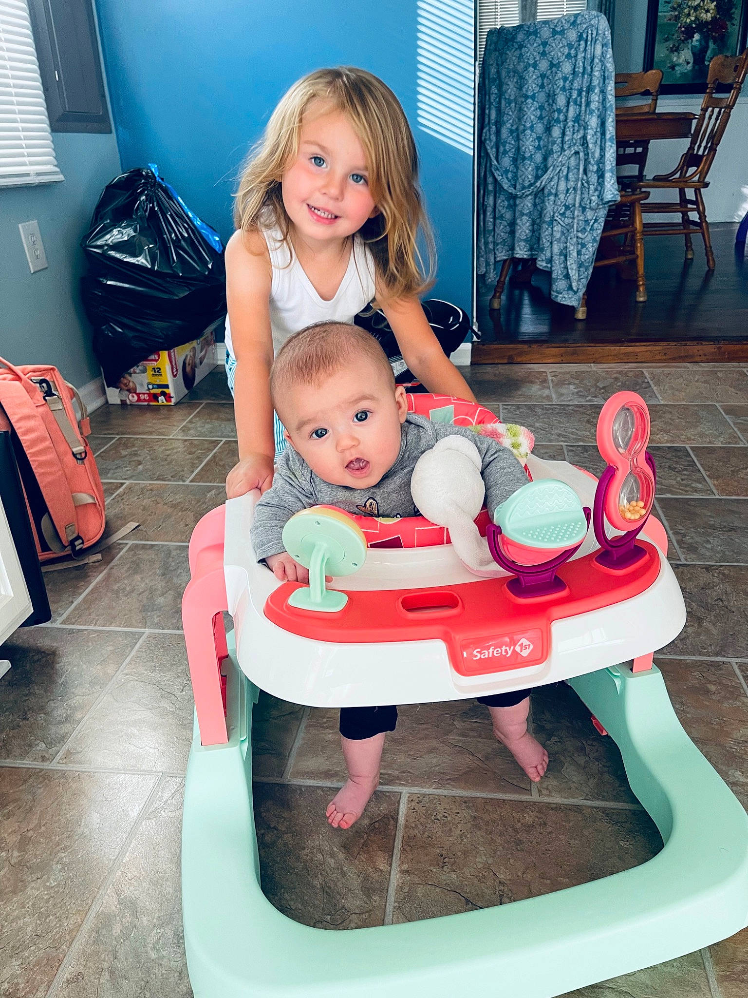 Julia joined the competition — help win amazing prizes! baby, baby_toddler_clothing, blue, chair, child, comfort, face, flooring, fun, furniture, happy, human_body, joy, lap, leg, leisure, person, shoe, sitting, smile