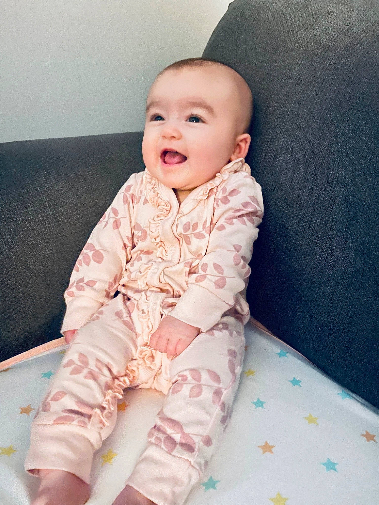 Julia joined the competition — help win amazing prizes! baby, baby_toddler_clothing, cheek, child, collar, comfort, couch, happy, leg, linens, magenta, neck, pattern, person, pink, sitting, skin, sleeve, smile, textile