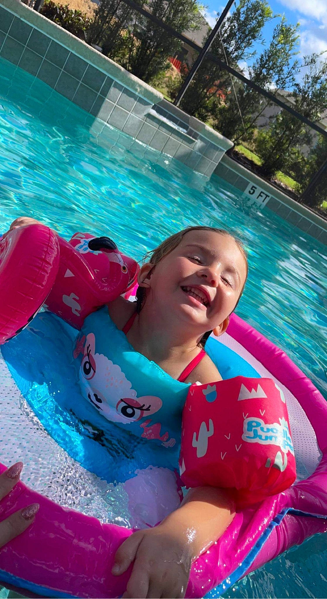 Ava joined the competition — help win amazing prizes! aqua, azure, baby, baby_float, blue, child, fun, games, happy, joy, leisure, outdoor_recreation, person, personal_protective_equipment, pink, recreation, red, smile, swimming_pool, toddler