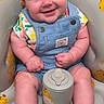 Callie Rae joined the competition — help win amazing prizes! baby, smiling, child, overalls, blue_clothing, floral_shirt, giraffe_pattern, baby_chair, cute, happy, infant, sitting, indoors, plush, footwear_free, skin, face, portrait, bright, colorful