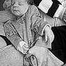Alyana a rejoint le concours — aidez-le/la à gagner de superbes lots ! adult, baby, black_and_white, closeup, clothing, cozy, cute, hand, holding, infant, monochrome, newborn, patterned_clothing, peaceful, person, portrait, resting, sleeping, socks, tender