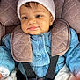 baby, bundle, car_seat, child, closeup, cute, face, hat, indoor, infant, jacket, padded, person, pom_pom, portrait, seatbelt, smile, straps, warm_clothing, young_child
