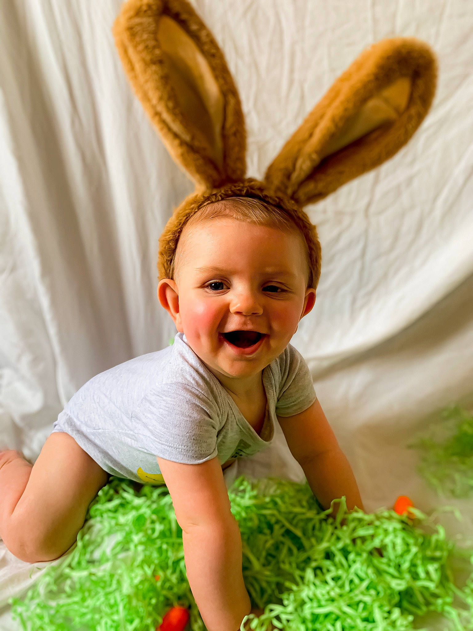 Grayson is registered to the contest to win money with this photo: baby, baby_toddler_clothing, child, costume_hat, ear, event, fawn, fun, fur, grass, green, happy, hat, head, people_in_nature, person, smile, tableware, textile, toddler