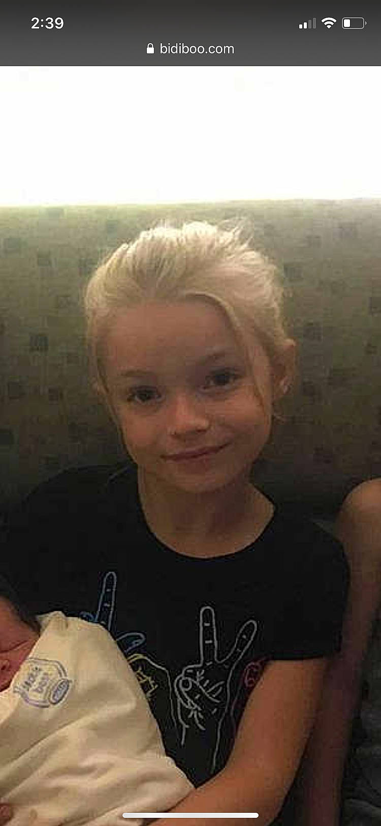 Evelyn is registered to the contest to win money with this photo: arm, blond, cheek, child, chin, eye, eyebrow, face, forehead, hair, hairstyle, head, human, joy, lip, long_hair, nose, person, photography, selfie