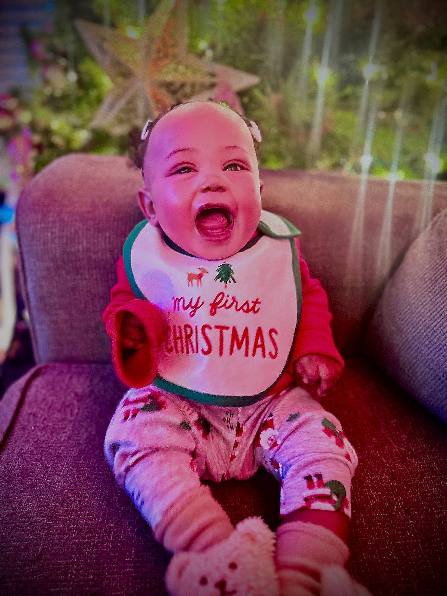 Dior is registered to the contest to win money with this photo: baby, baby_laughing, baby_products, baby_toddler_clothing, cheek, child, font, fun, grass, happy, laugh, magenta, person, photo_caption, pink, plant, purple, sitting, sleeve, smile