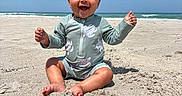 Tru joined the competition — help win amazing prizes! baby, child, beach, sand, ocean, sky, sunny, smiling, sitting, cute, swimsuit, turtle_pattern, happy, hands, feet, nature, outdoor, portrait, water, vacation