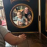baby, woman, mirror, reflection, crawling, smiling, wooden_floor, living_room, phone, glasses, person, home, furniture, carpet, hand, casual_clothing, happy, indoor, child, portrait