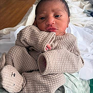 Cairo joined the competition — help win amazing prizes! newborn, baby, infant, cozy, blanket, bed, clothing, face, portrait, cute, sleepwear, indoors, soft, texture, hand, expression, resting, warm, child, person