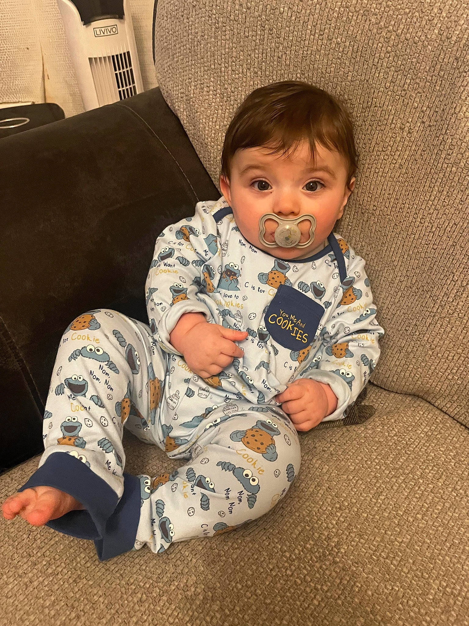 Lorenzo is registered to the contest to win money with this photo: baby, baby_toddler_clothing, carmine, cheek, child, comfort, couch, eye, floor, flooring, foot, hairstyle, happy, head, mammal, person, sitting, skin, sleeve, toddler