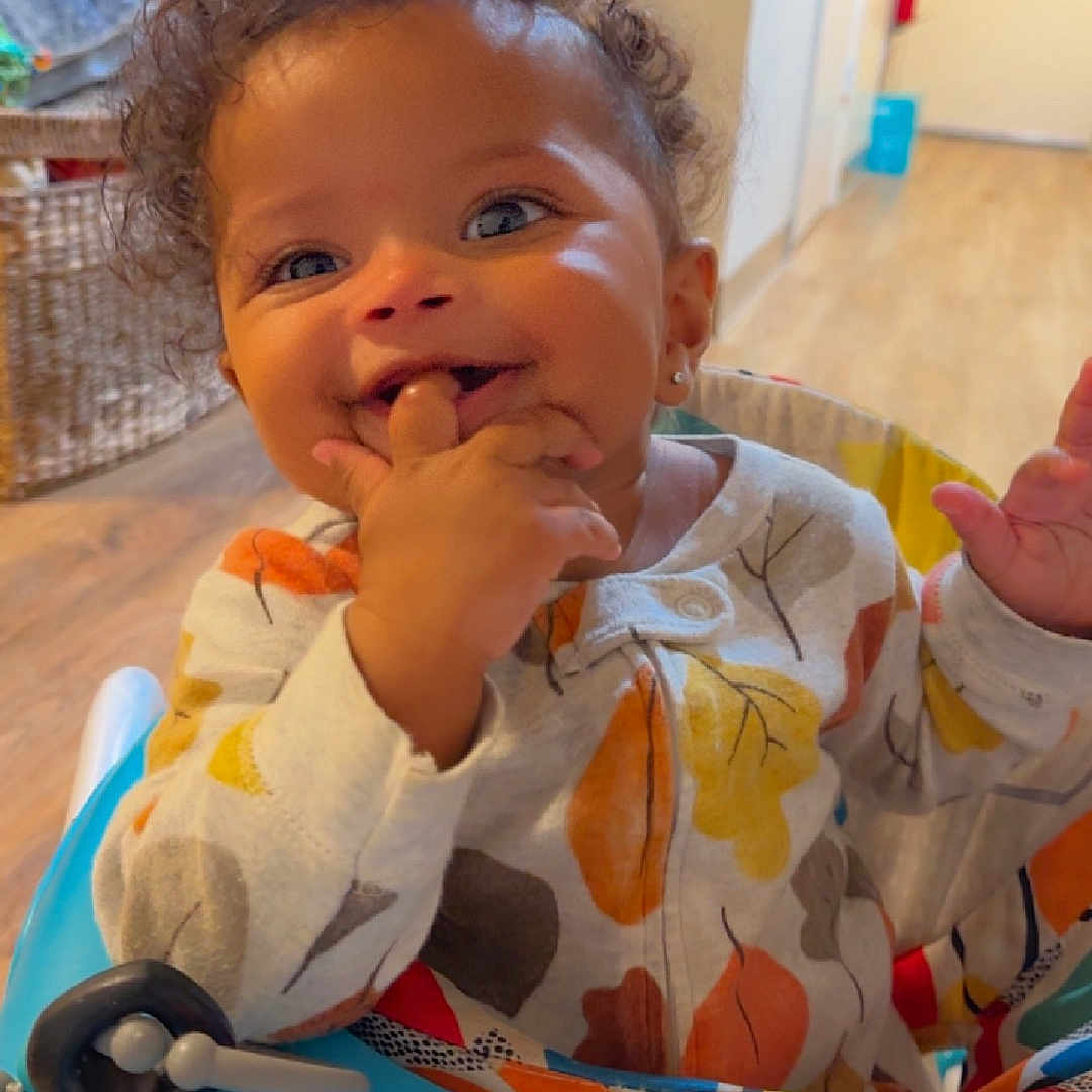 Brynlee joined the competition — help win amazing prizes! baby, bodypart, couch, cutlery, eating, face, finger, food, furniture, hand, happy, head, indoors, person, photography, portrait, sitting, smile, spoon, wood