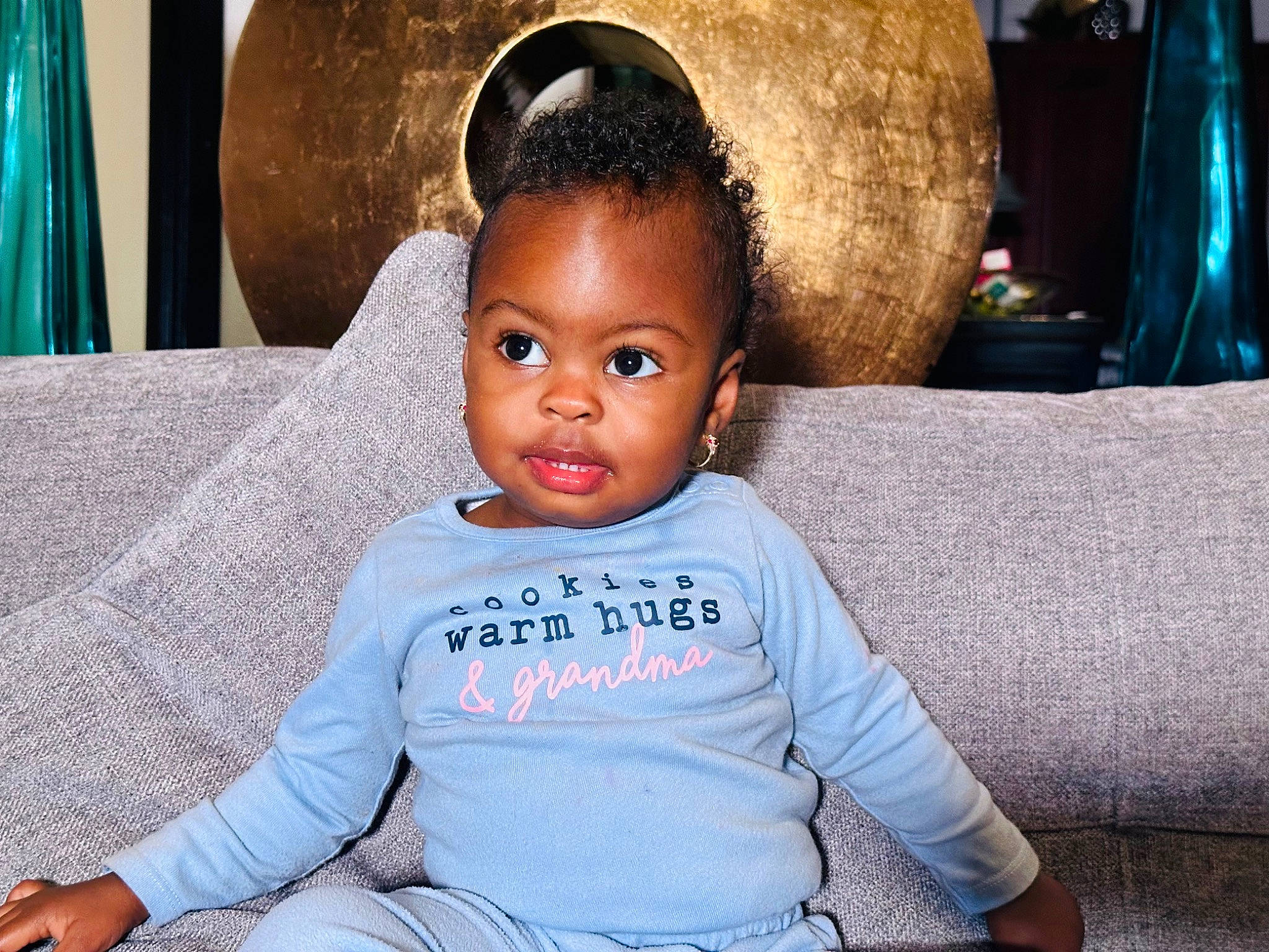 Nala is registered to the contest to win money with this photo: baby_toddler_clothing, blue, cheek, child, chin, comfort, couch, eye, face, flash_photography, fun, hair, happy, head, iris, neck, nose, person, skin, sleeve