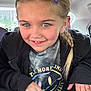 Angel joined the competition — help win amazing prizes! child, girl, smiling, braid, hair_clip, face, clothing, jacket, tshirt, car_interior, seat, window, hand, portrait, happy, casual, young, person, indoor, cute
