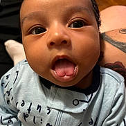 Tadeo joined the competition — help win amazing prizes! baby, infant, close_up, tongue_out, cute, child, portrait, face, expression, clothing, blue_outfit, young_child, indoors, person, skin, head, eyes, mouth, tongue, adorable