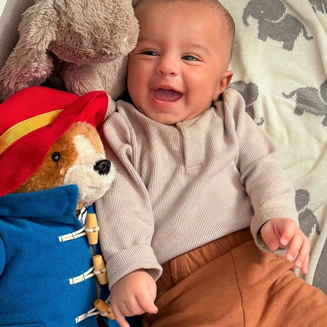 Shahmeer is registered to the contest to win money with this photo: baby, bed, blanket, clothing, crib, cushion, face, furniture, happy, head, homedecor, infantbed, newborn, pants, person, photography, plush, portrait, teddybear, toy