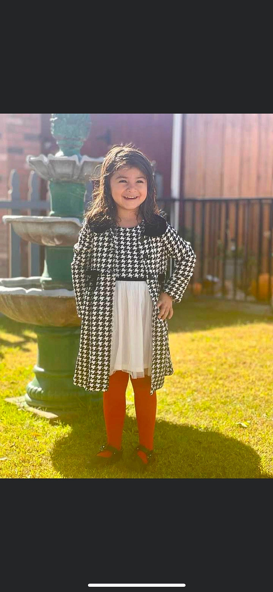 Erica is registered to the contest to win money with this photo: black_hair, brown_hair, cool, fashion_design, formal_wear, fun, grass, hair, happy, headwear, human_leg, joy, knee, leisure, long_hair, pattern, person, sleeve, textile, thigh