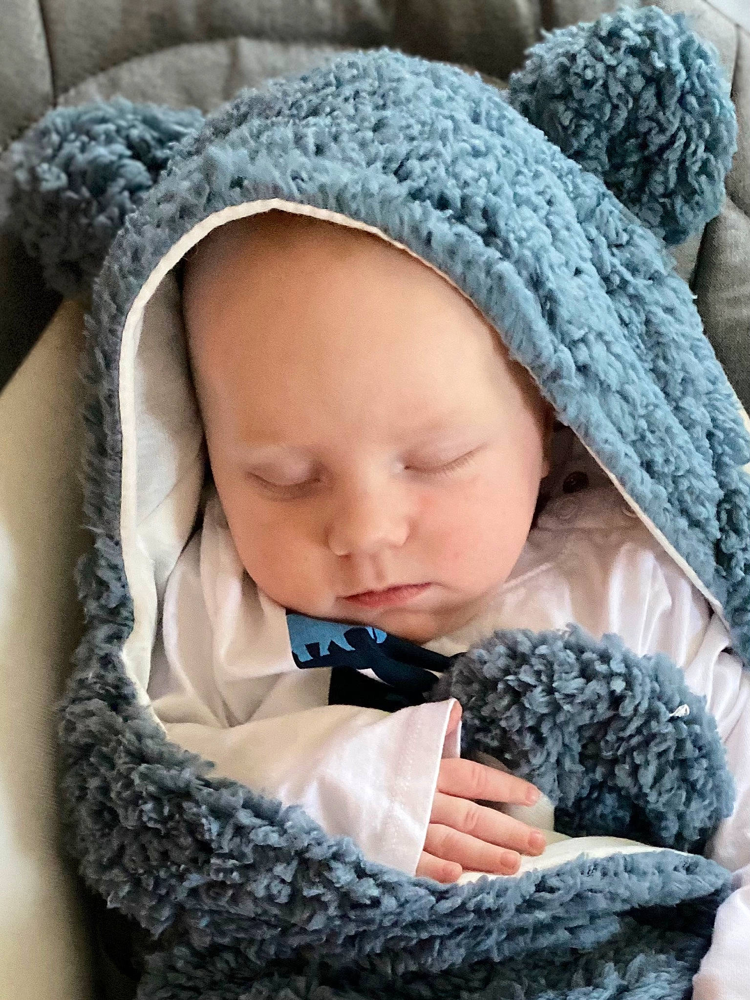 Dax is registered to the contest to win money with this photo: baby, baby_sleeping, baby_toddler_clothing, beanie, blue, cap, cheek, child, comfort, fur, headgear, knit_cap, linens, outerwear, pattern, person, product, textile, toddler, wool