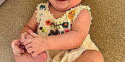 Ivy is registered to the contest to win money with this photo: baby, child, couch, cute, dress, embroidery, fabric, foot, hand, happy, headband, indoors, infant, person, playful, portrait, sitting, skin, smiling, texture