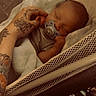 Stetson joined the competition — help win amazing prizes! baby, sleeping, pacifier, blanket, crib, mesh, tattoo, hand, infant, cozy, resting, peaceful, person, newborn, bedtime, soft, indoor, cute, toddler, parental_care