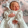 Eloise is registered to the contest to win money with this photo: baby, blanket, bodypart, bonnet, clothing, dress, face, fashion, finger, formalwear, gown, hand, hat, head, lace, newborn, person, photography, portrait, sleeping