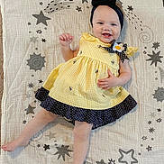 Eloise is registered to the contest to win money with this photo: baby, babylaughing, beachwear, clothing, dress, face, happy, hat, head, homedecor, laughing, pants, pattern, person, photography, portrait, sitting, sleeve, smile, standing