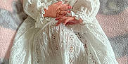 Eloise is registered to the contest to win money with this photo: baby, blanket, bonnet, clothing, dress, face, fashion, formalwear, gown, happy, hat, head, lady, newborn, person, photography, portrait, sleeping, smile, wedding