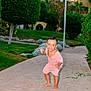 barefoot, building, bushes, child, cute, daylight, garden, grass, greenery, happy, lamp_post, nature, outdoor, pathway, pink_clothing, playful, portrait, smiling, toddler, tree