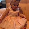 Saylor is registered to the contest to win money with this photo: baby, chair, child, curious, cute, decor, flower, furniture, headband, indoors, infant, pearl, people, person, pink_dress, portrait, sitting, soft, toddler, young