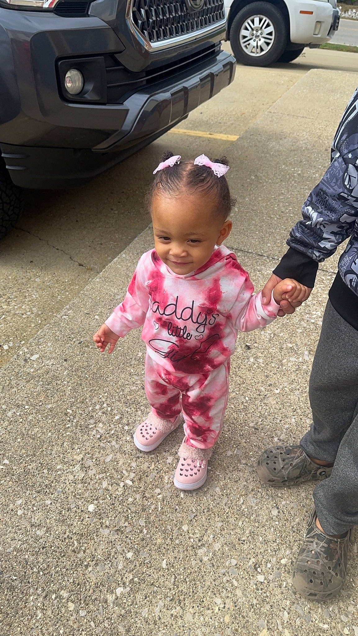 Myla is registered to the contest to win money with this photo: asphalt, automotive_design, automotive_exterior, automotive_lighting, automotive_tire, baby_toddler_clothing, bumper, car, child, cool, grass, joy, motor_vehicle, parking, person, personal_luxury_car, road, tire, toddler, trunk