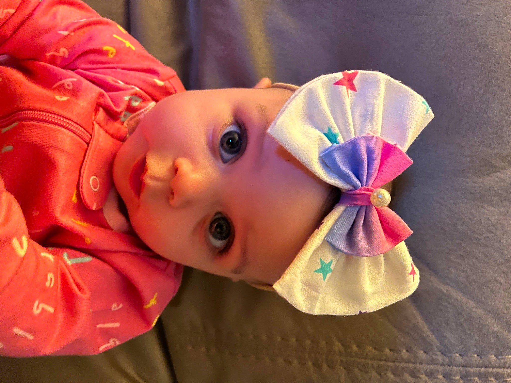 Saylor is registered to the contest to win money with this photo: baby, baby_toddler_clothing, cheek, child, chin, costume_hat, eyebrow, eyelash, facial_expression, fashion_accessory, happy, hat, headgear, headwear, lip, nose, person, petal, pink, skin