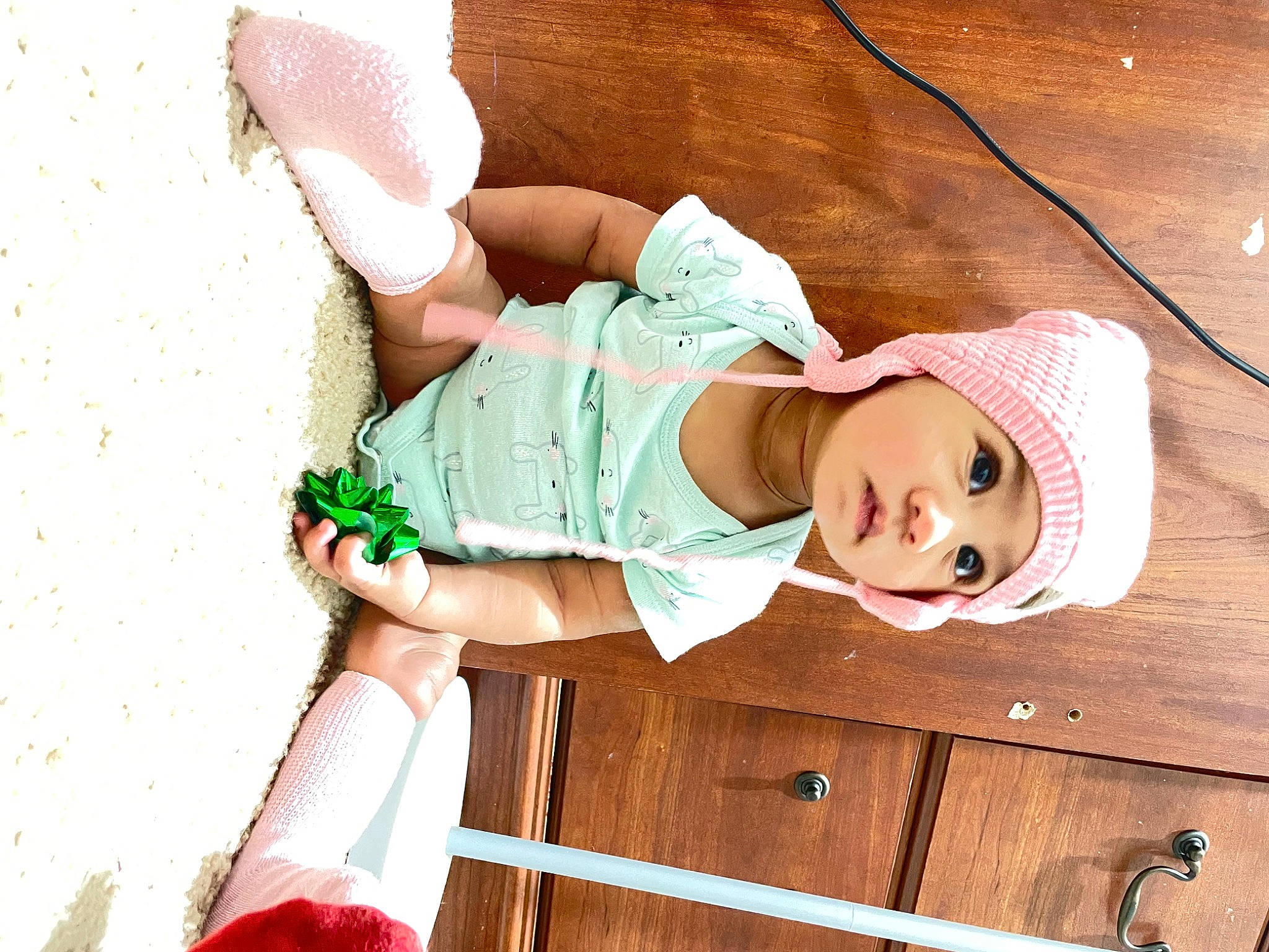 Day joined the competition — help win amazing prizes! baby, baby_products, baby_toddler_clothing, elbow, facial_expression, fashion_accessory, happy, hat, headgear, headwear, human_body, human_leg, knee, person, pink, sleeve, sun_hat, thigh, toddler, white