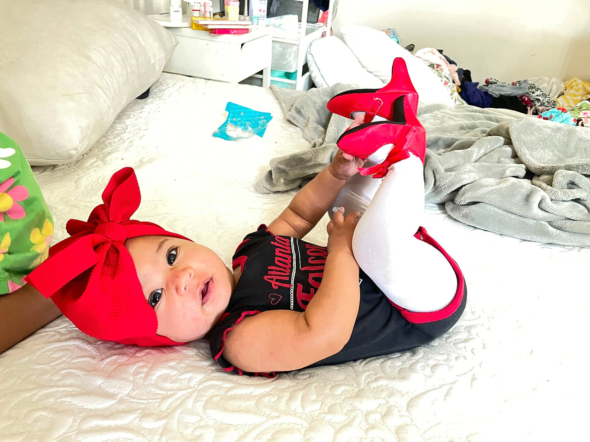 Day joined the competition — help win amazing prizes! abdomen, bedding, carmine, child, comfort, elbow, flesh, flooring, foot, headwear, human_leg, knee, lap, leg, linens, person, room, sitting, sock, stuffed_toy