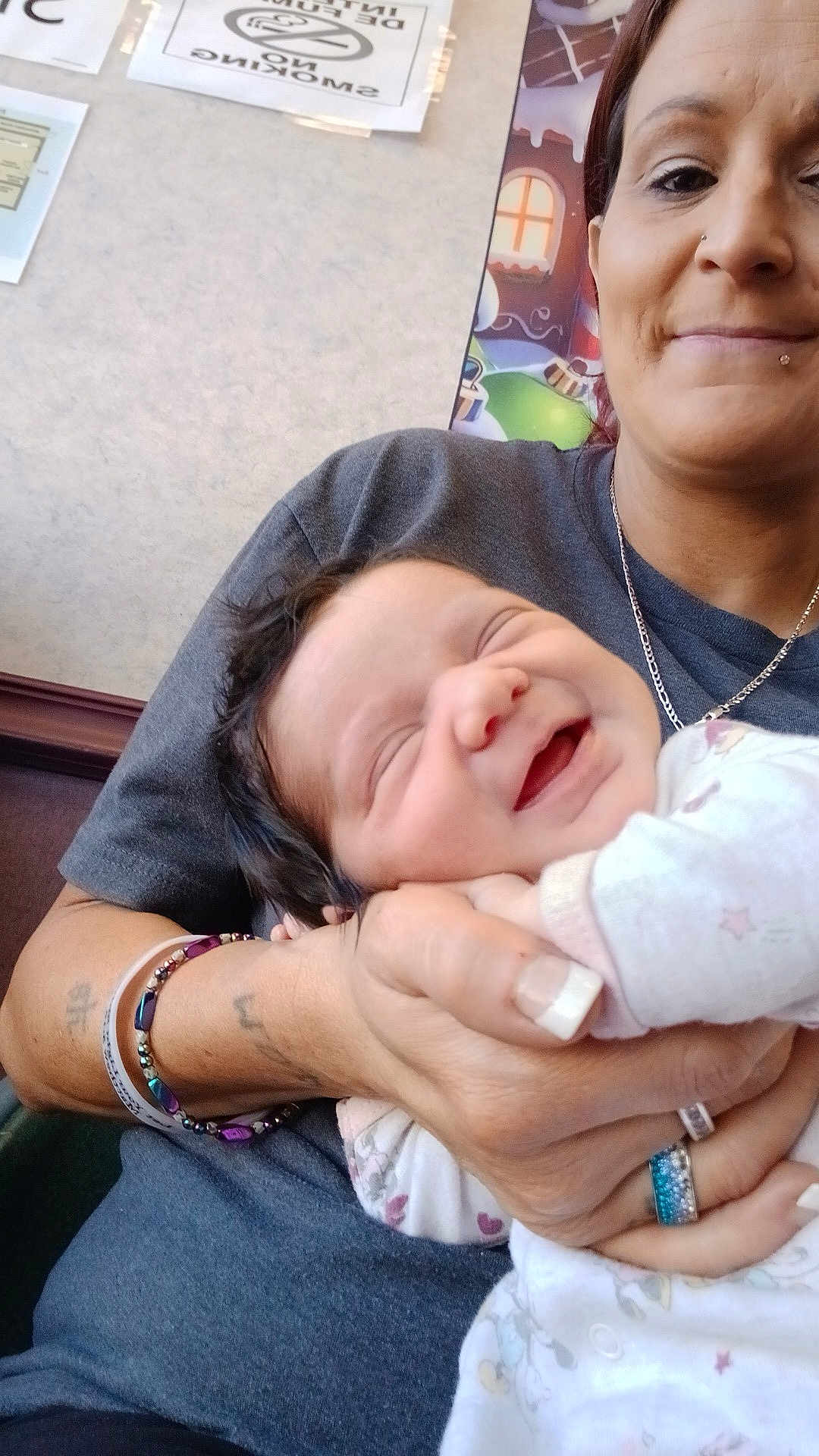 Devyn is registered to the contest to win money with this photo: baby, woman, smiling, indoor, holding, happy, face, person, jewelry, bracelet, ring, clothing, portrait, skin, hand, nail, expression, infant, cute, love