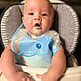 baby, high_chair, bib, food, messy, child, infant, cute, face, mouth, hands, blue, plastic, smile, skin, eyes, sitting, feeding, indoor, young