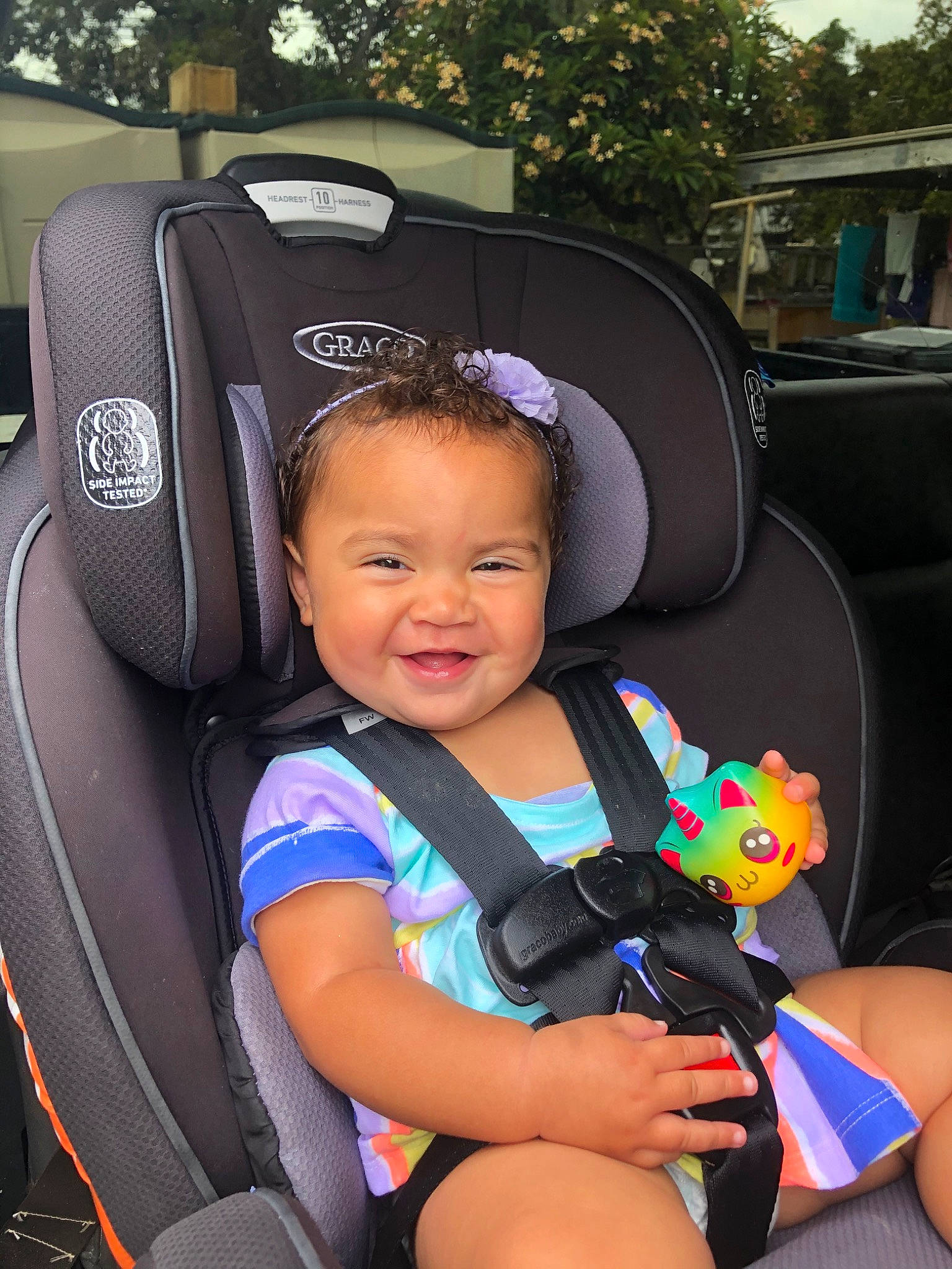 Majesty is registered to the contest to win money with this photo: auto_part, baby, baby_carriage, baby_in_car_seat, baby_products, car, car_seat, car_seat_cover, child, head_restraint, person, product, seat_belt, steering_wheel, toddler, vacation, vehicle