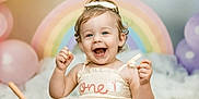 Hadleigh joined the competition — help win amazing prizes! baby, background, balloons, birthday, bow, celebration, child, cute, dress, face, food, hands, happy, indoors, party, portrait, rainbow, sitting, smiling, toddler