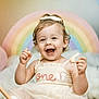 Hadleigh joined the competition — help win amazing prizes! baby, toddler, child, smiling, happy, birthday, party, dress, bow, rainbow, balloons, background, celebration, cute, face, portrait, sitting, hands, food, indoors