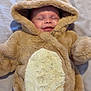 antlers, baby, bed, blanket, child, closed_eyes, costume, cozy, cute, face, fur, hood, indoors, infant, lying_down, reindeer, sleeping, smiling, soft, warm