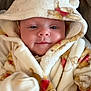 Lilly-Joan joined the competition — help win amazing prizes! apparel, baby, blanket, child, closeup, comfort, couch, cute, face, fur, headwear, hood, indoors, infant, person, portrait, smile, soft, warm, young