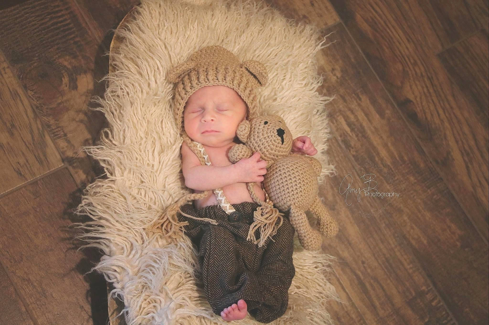 Rhett is registered to the contest to win money with this photo: baby, child, comfort, doll, eye, fashion_accessory, fashion_design, fawn, flash_photography, flooring, fur, headgear, headwear, human_body, iris, person, sitting, stuffed_toy, textile, toy