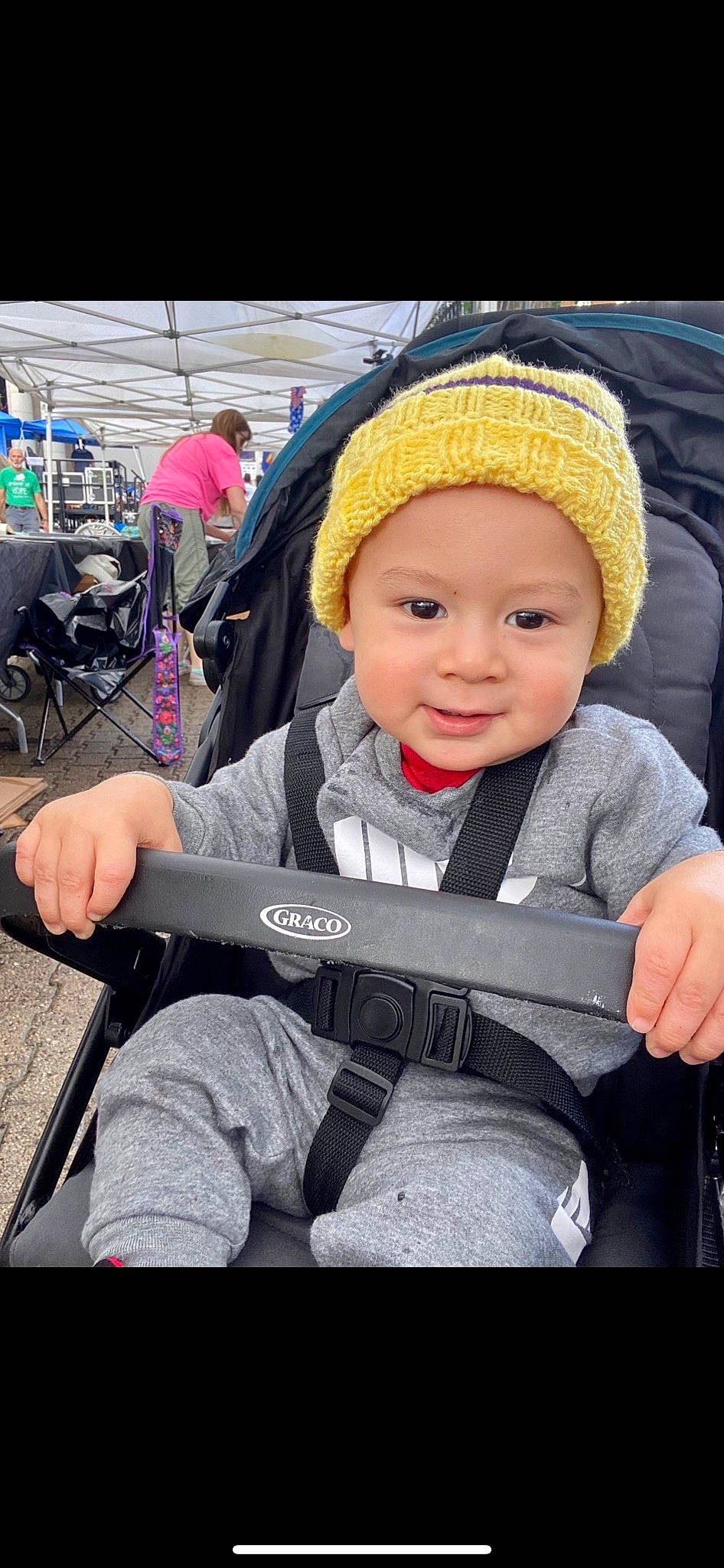 Nathaniel joined the competition — help win amazing prizes! baby, baby_carriage, baby_products, cap, chair, child, city, fashion_accessory, fun, headwear, jacket, knit_cap, leisure, mobile_phone, person, product, recreation, sitting, skin, smile
