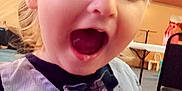 Ryan joined the competition — help win amazing prizes! child, toddler, face, smiling, indoor, clothing, vest, bow_tie, happy, person, table, chair, furniture, expression, cute, portrait, young_child, blonde_hair, open_mouth, casual