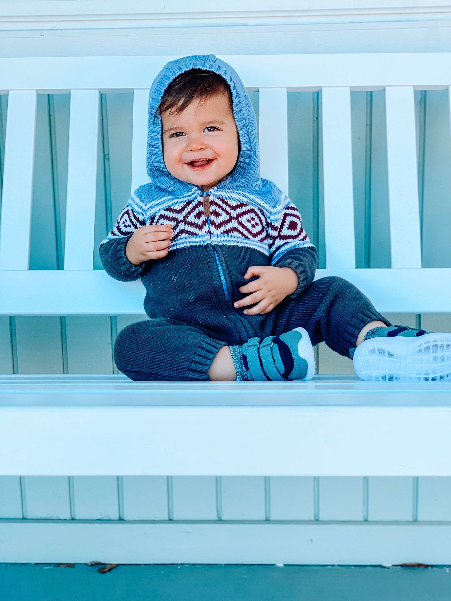 Judah is registered to the contest to win money with this photo: aqua, azure, baby, baby_products, baby_toddler_clothing, blue, electric_blue, face, flash_photography, happy, hat, joy, pattern, person, product, rectangle, room, sleeve, smile, t_shirt