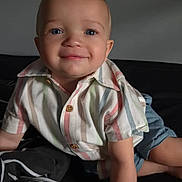 Leonardo joined the competition — help win amazing prizes! toddler, child, smiling, blue_eyes, striped_shirt, denim_shorts, crawling, indoor, couch, cheerful, portrait, cute, baby, person, casual_clothing, happy, skin, face, short_hair, buttoned_shirt