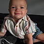 toddler, child, smiling, blue_eyes, striped_shirt, denim_shorts, crawling, indoor, couch, cheerful, portrait, cute, baby, person, casual_clothing, happy, skin, face, short_hair, buttoned_shirt