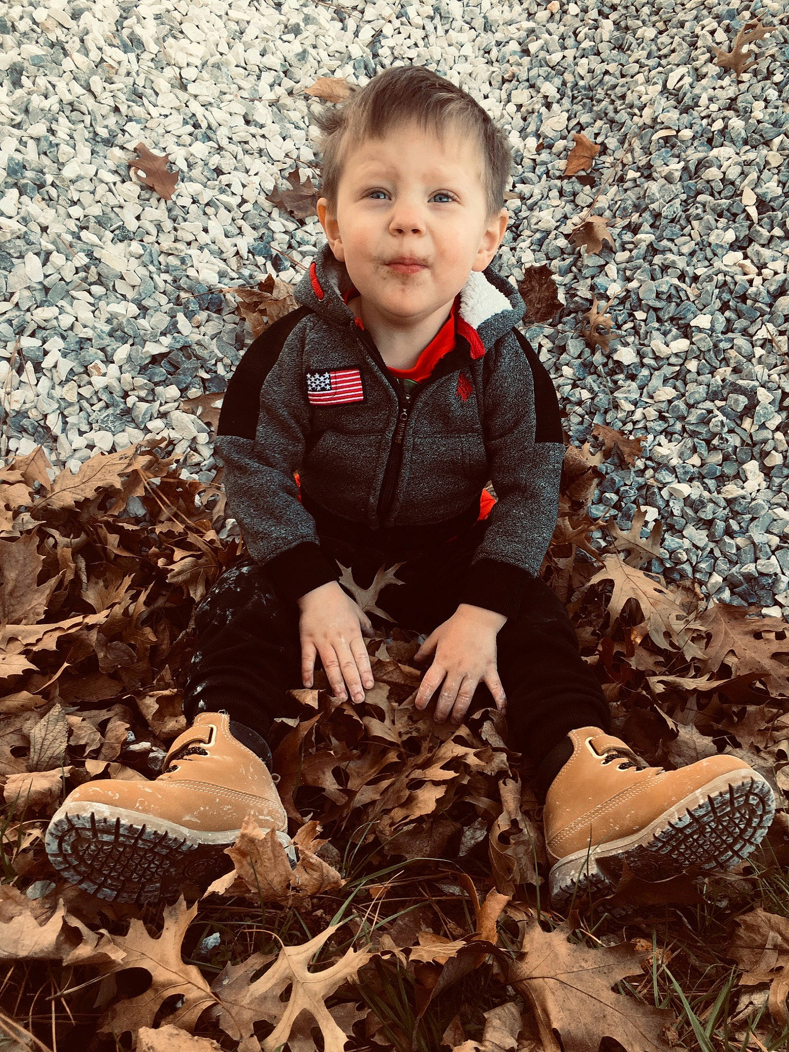 Connor Nash is registered to the contest to win money with this photo: autumn, baby, baby_toddler_clothing, child, deciduous, face, fun, grass, happy, head, landscape, people_in_nature, person, sand, shadow, sitting, smile, soil, tints_and_shades, toddler