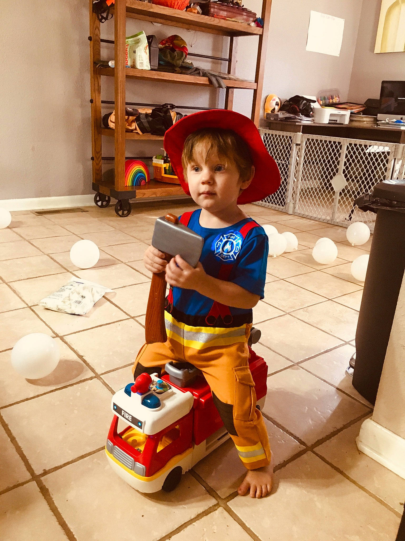 Connor Nash joined the competition — help win amazing prizes! baby, bag, box, cart, child, cleanliness, floor, flooring, fun, hat, lamp, person, play, room, shelf, shelving, shoe, standing, toddler, toy