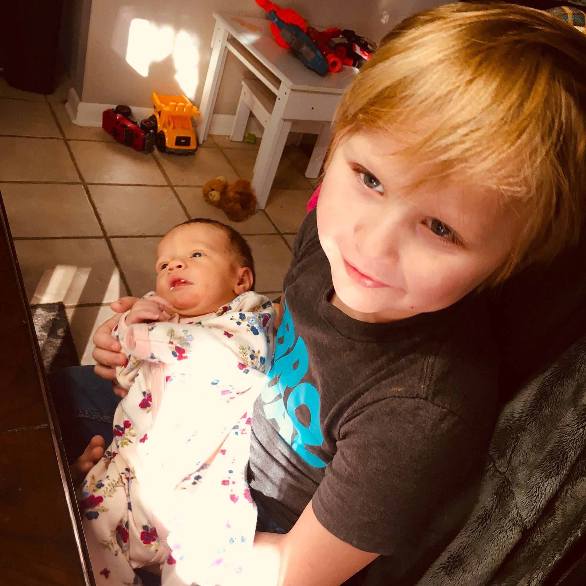 Ryder is registered to the contest to win money with this photo: baby, baby_toddler_clothing, cheek, child, comfort, facial_expression, fun, hair, happy, head, iris, joy, lap, mammal, mouth, nose, person, sitting, skin, smile