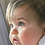 baby, child, face, portrait, close_up, blue_eyes, curly_hair, soft_light, infant, cute, expression, skin, cheeks, clothing, newborn, indoors, person, young, looking, side_view