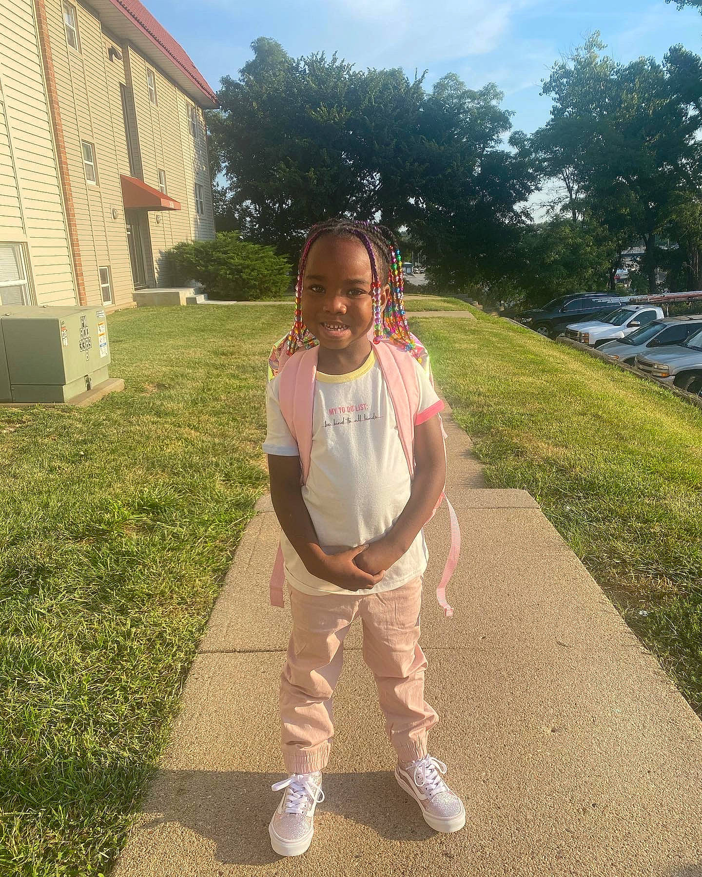 Kamani joined the competition — help win amazing prizes! asphalt, fun, grass, happy, house, joy, lawn, leaf, leg, leisure, person, plant, recreation, road_surface, sky, smile, sneakers, sunlight, t_shirt, toddler