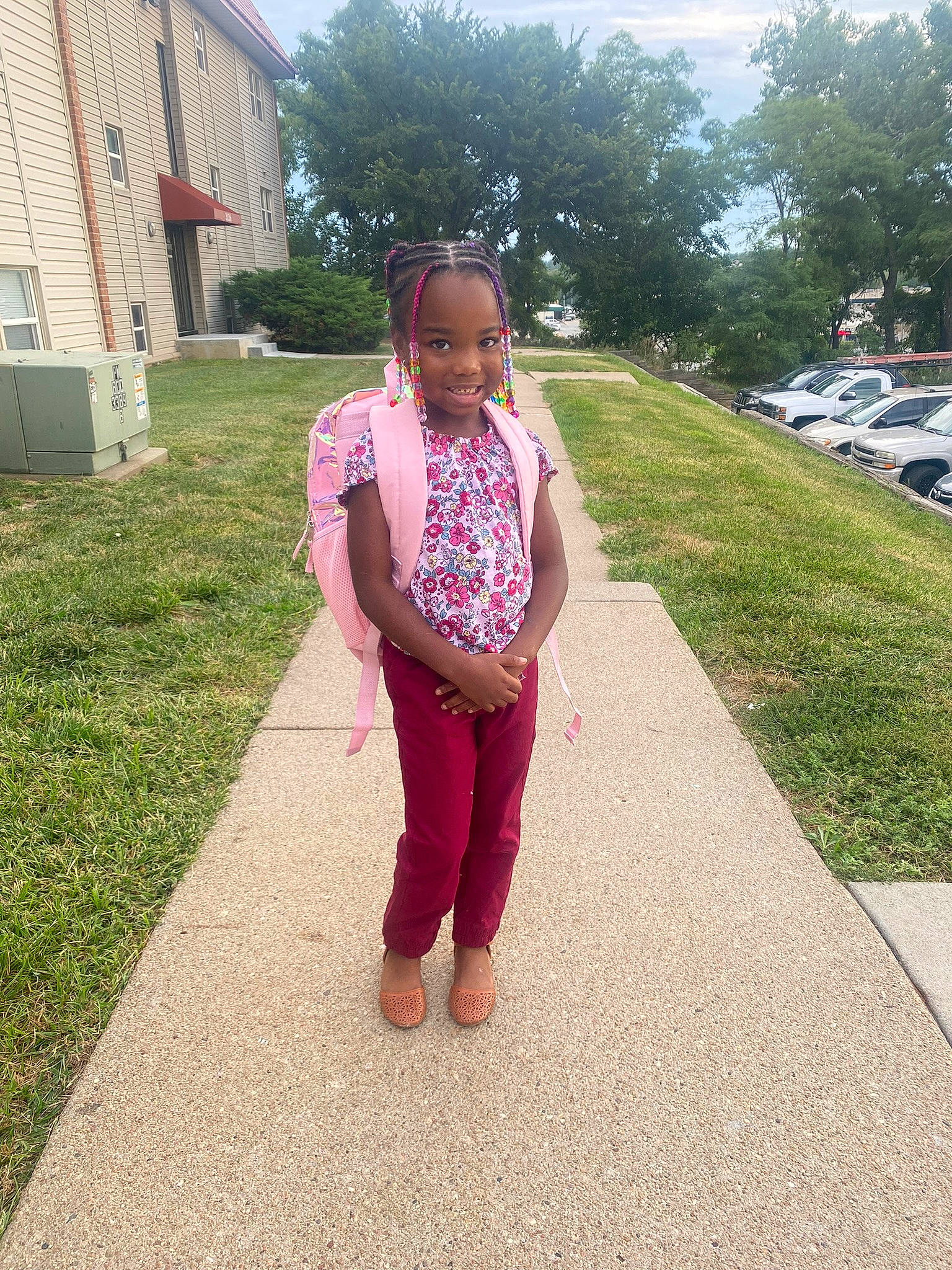 Kamani is registered to the contest to win money with this photo: asphalt, baby, building, face, flooring, grass, grass_family, happy, house, human_body, joy, leisure, magenta, person, plant, recreation, road_surface, sidewalk, sky, toddler